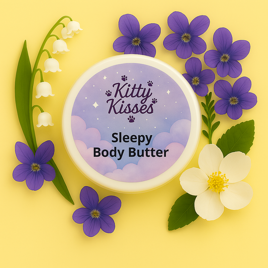 Kitty Kisses Sleepy Body Butter container with purple and white flowers on a yellow background