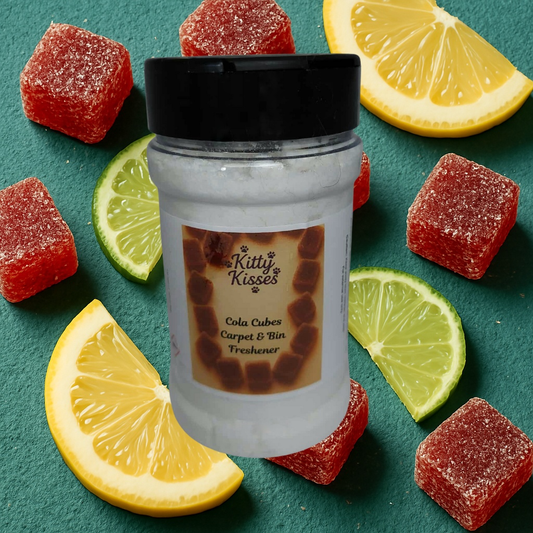Jar of 'Kitty Kisses' cola cubes carpet and bin freshener with gummy candies and lemon slices on a green background